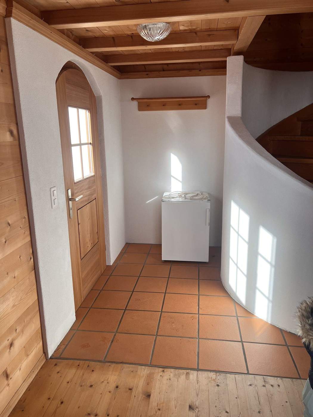 Entrance with spiral staircase