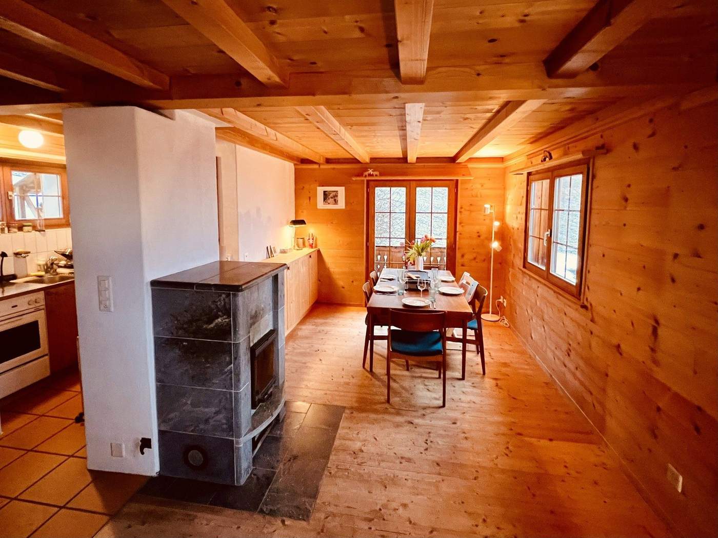 Living and dining area with soapstone stove